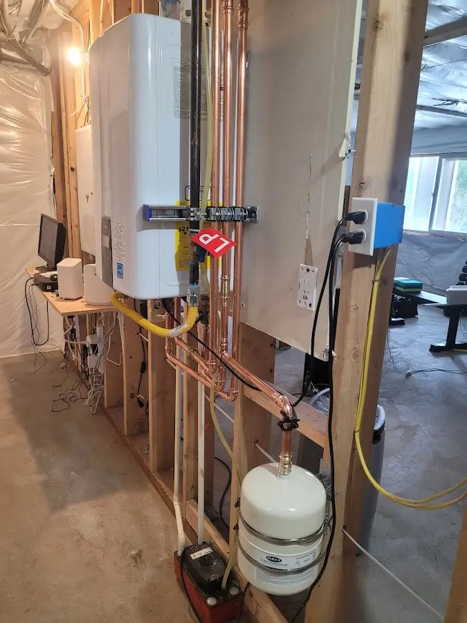 Licensed plumber repairing a kitchen sink in Harrisonburg